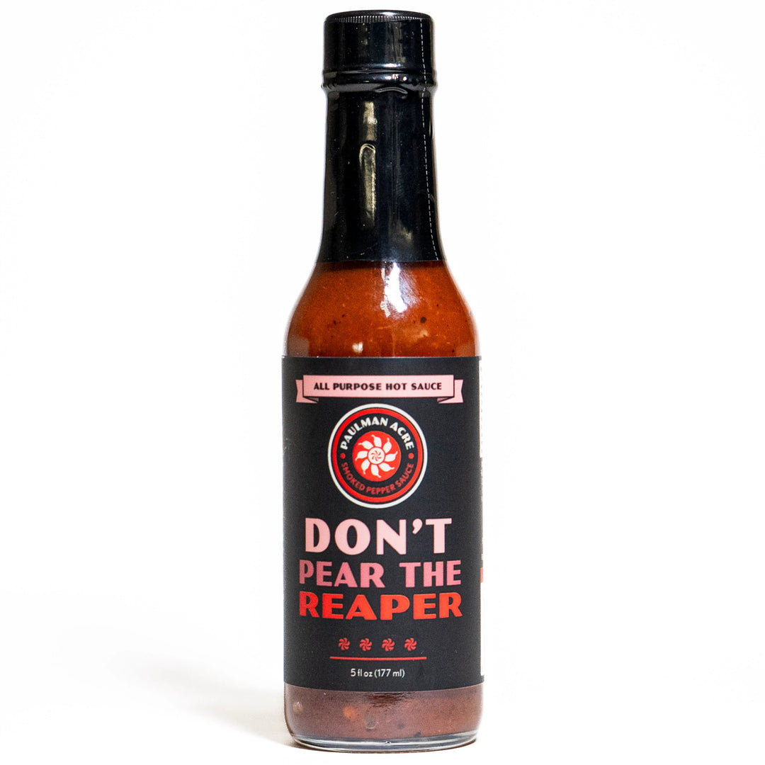 Bottle of Paulman Acre Don't Pear the Reaper Hot Sauce with a label featuring the product name and a red circular graphic, against a white background.