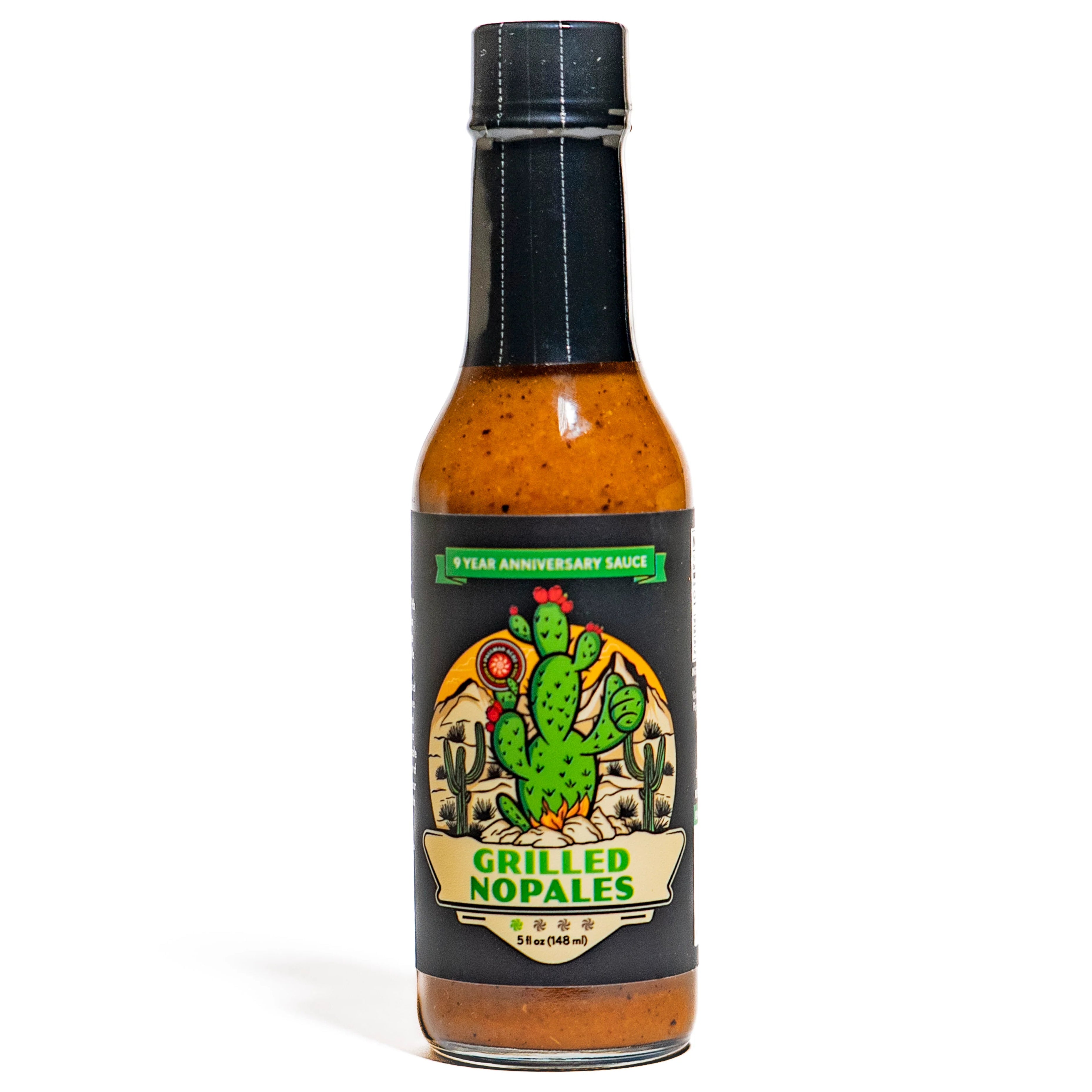 A bottle of Paulman Acre Grilled Nopales Hot Sauce with a label featuring a green cactus and the text '9th Anniversary Sauce'.